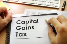 How can investors reduce capital gains tax after strong market growth?