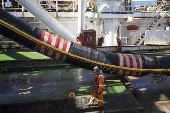 An enormous sucker pipe brings diamond bearing gravel from the seabed aboard the Mafuta for processing. Up to 60 tonnes of sediment can be lifted every hour. Picture: Simon Dawson/Bloomberg