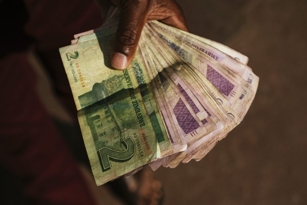Zimbabwe stops short of free-floating currency in exchange rate battle ...
