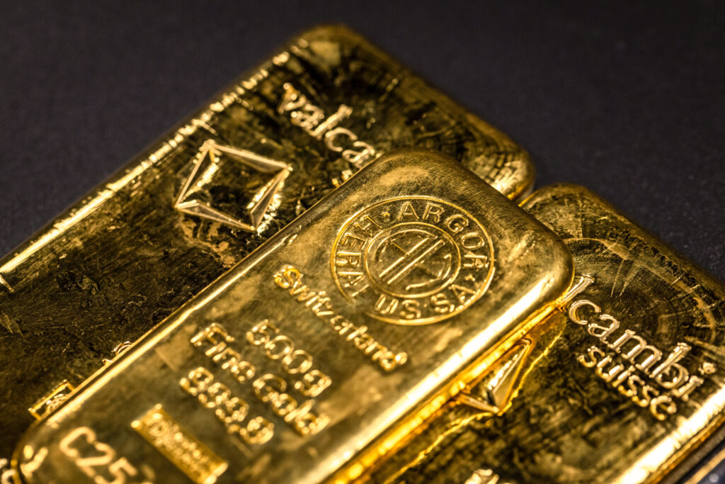 Gold edges lower as investors track US trade policy and dollar - Moneyweb
