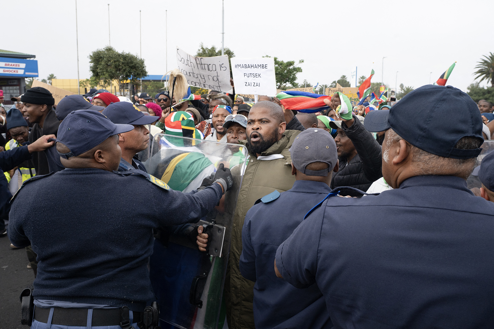 Heavy police presence keeps a lid on anti-immigrant violence