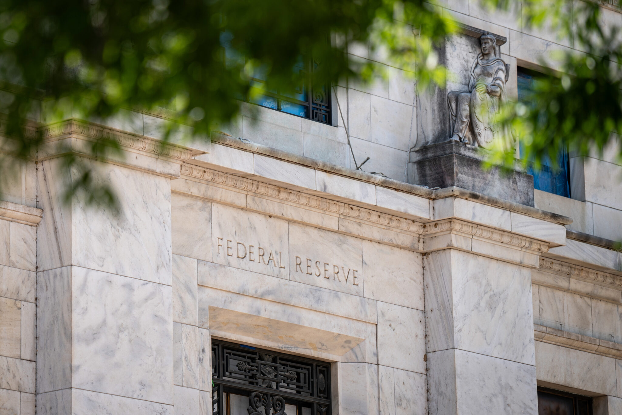 Fed raises rates, signals another hike as inflation persists